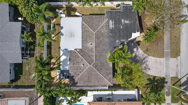 an aerial view of residential houses with city view