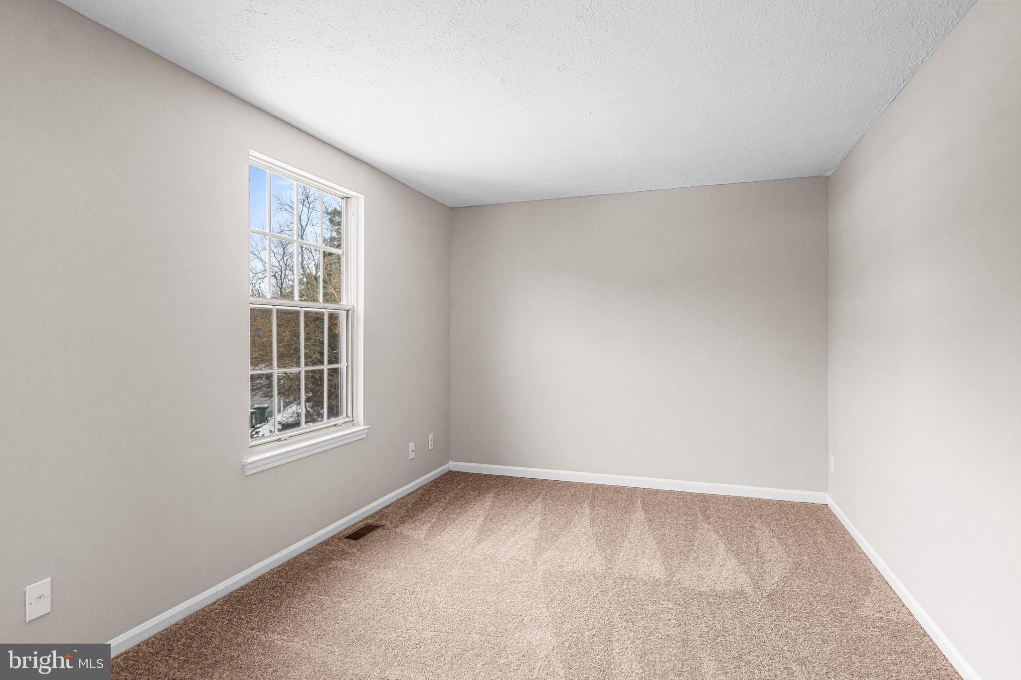 67 Dorchester Circle Marlton, NJ 08053 - Photo 12 of 25 an empty room with a window