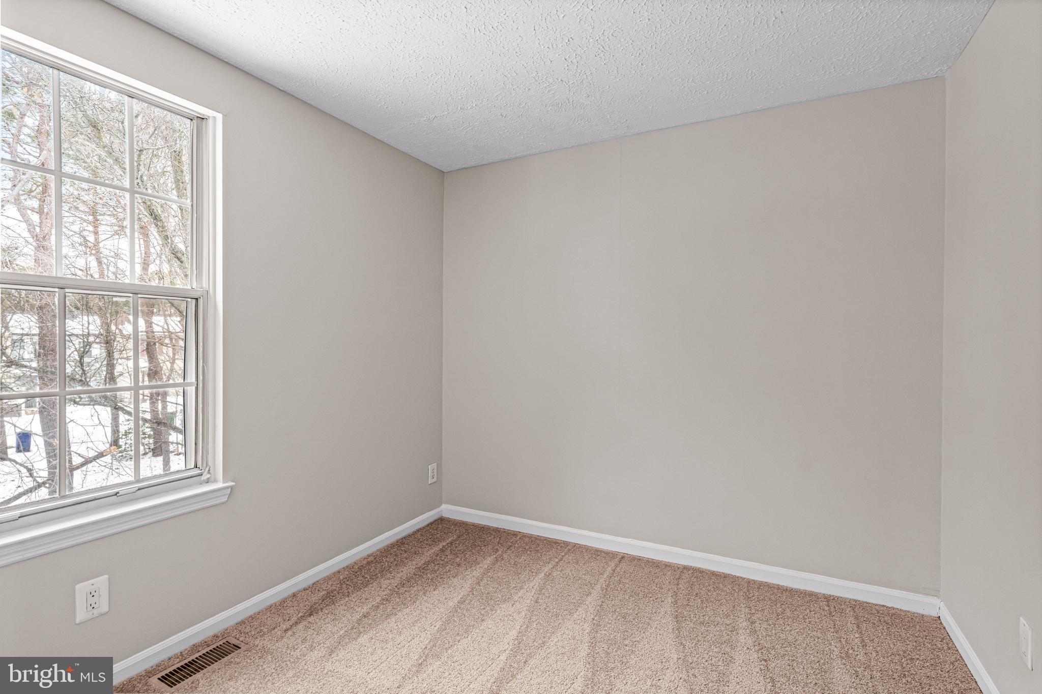 67 Dorchester Circle Marlton, NJ 08053 - Photo 13 of 25 a view of an empty room with a window