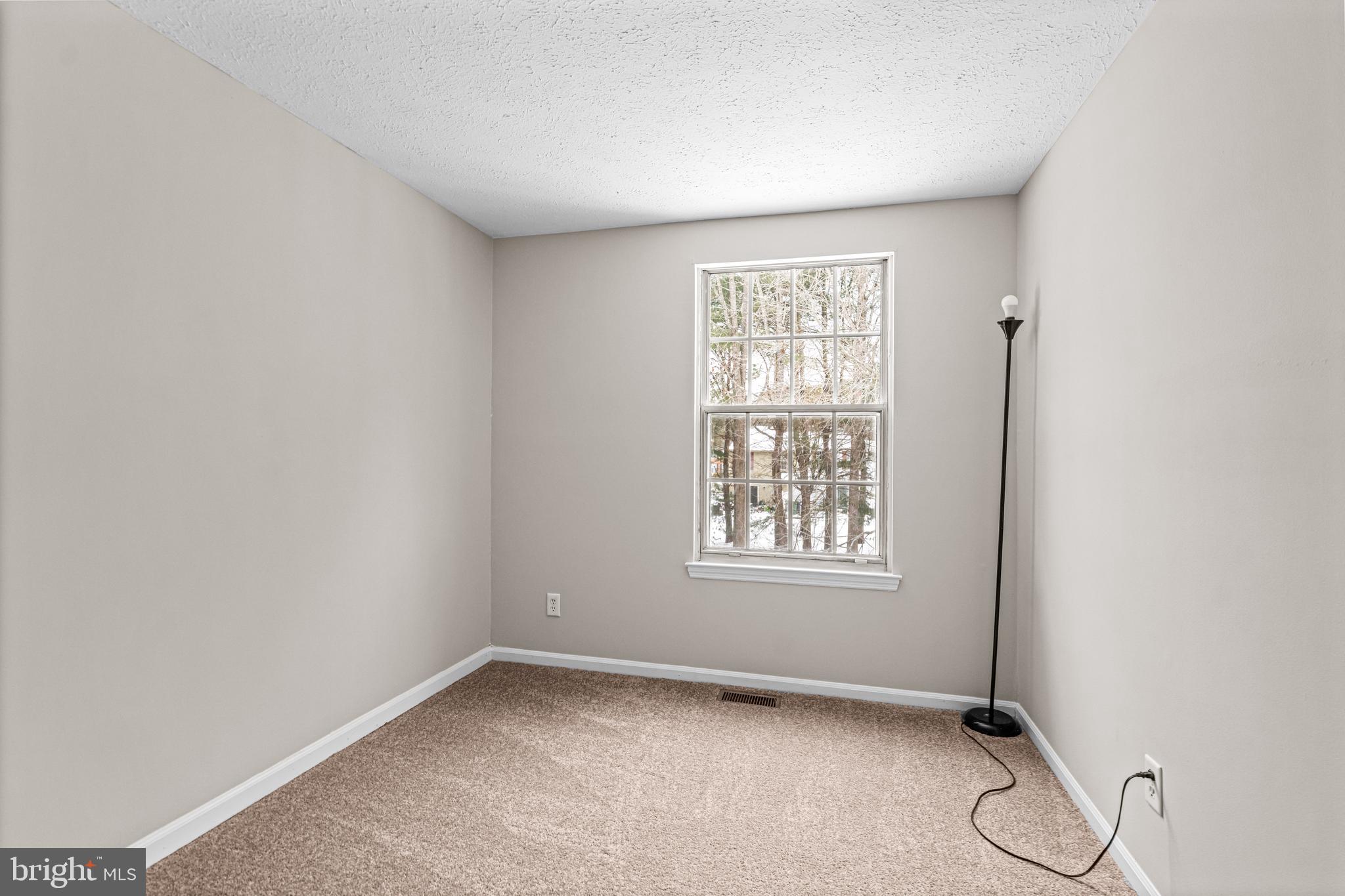 67 Dorchester Circle Marlton, NJ 08053 - Photo 14 of 25 an empty room with windows