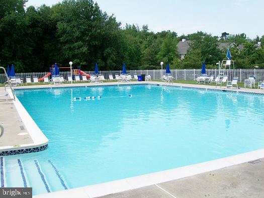 67 Dorchester Circle Marlton, NJ 08053 - Photo 20 of 25 a view of a swimming pool with chairs