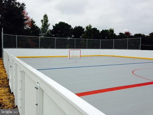67 Dorchester Circle Marlton, NJ 08053 - Photo 22 of 25 a view of swimming pool with large trees and wooden fence