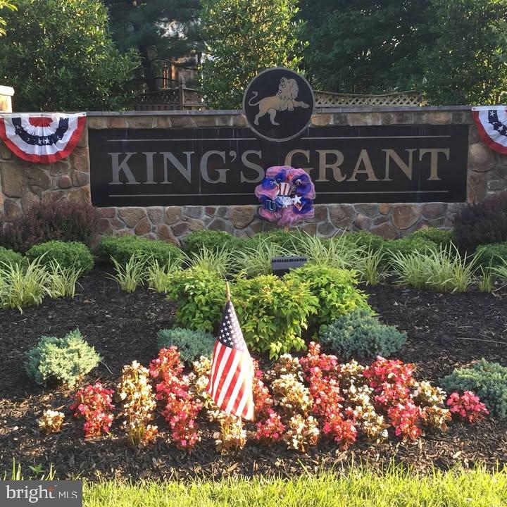 67 Dorchester Circle Marlton, NJ 08053 - Photo 3 of 25 a street sign on a bunch of flowers