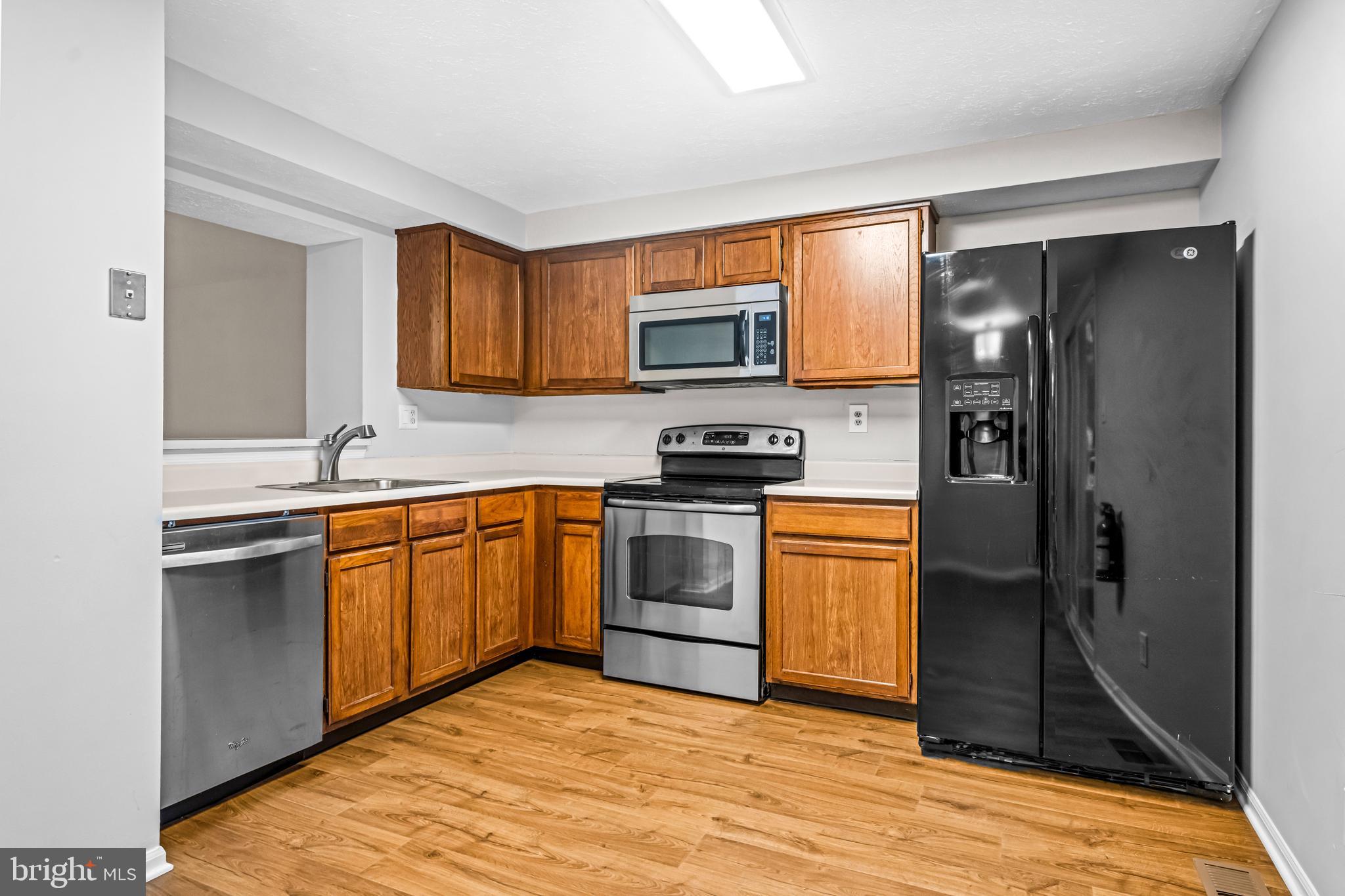 67 Dorchester Circle Marlton, NJ 08053 - Photo 5 of 25 a kitchen with stainless steel appliances granite countertop a refrigerator stove and sink
