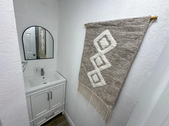 a bathroom with a sink and mirror