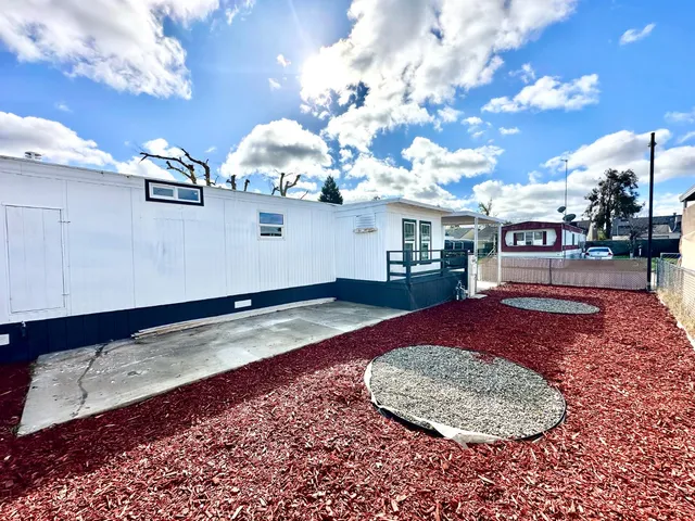 a view of a living room and kitchen