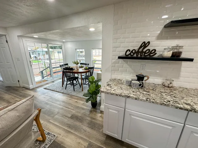 a kitchen with sink and cabinets