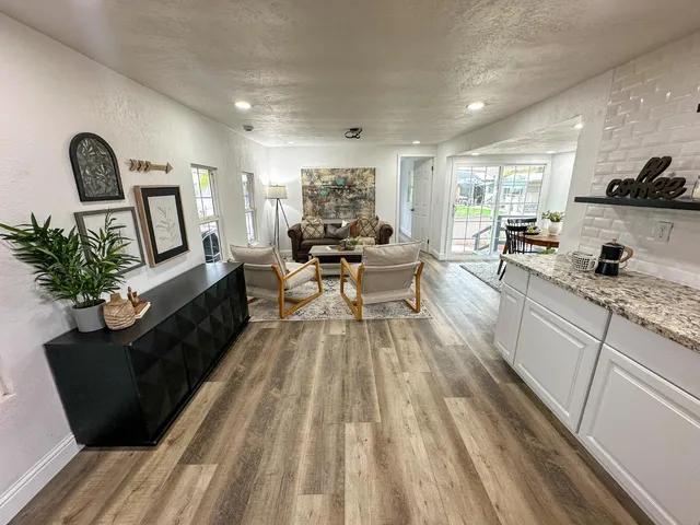 a living room with furniture and a large window