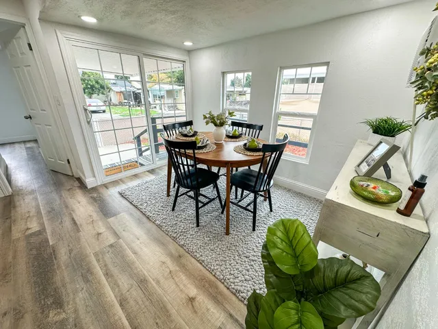 a view of a dining room with furniture window and wooden floor