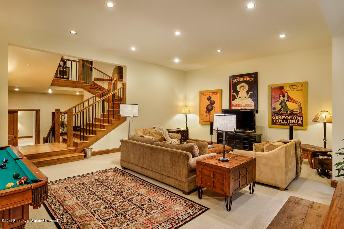 64 Prospector Road, Unit 7 Aspen, CO 81611 - Photo 11 of 23 a living room with fireplace furniture and a rug