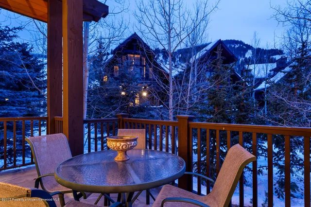 a outdoor dining space with furniture and wooden floor