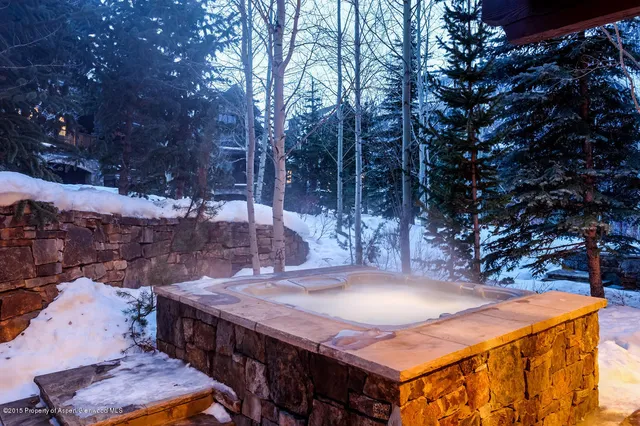 a view of a backyard with table and chairs