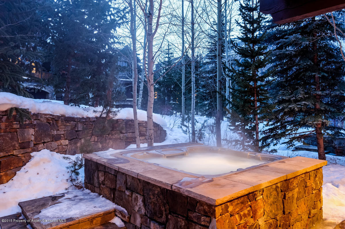 64 Prospector Road, Unit 7 Aspen, CO 81611 - Photo 15 of 23 a view of a backyard with table and chairs