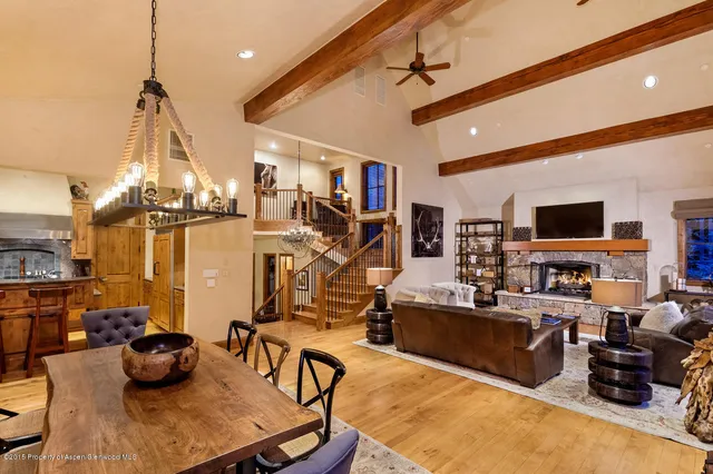 a living room with lots of furniture and gym equipment