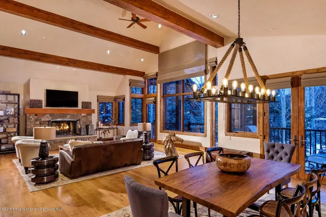 a living room with lots of furniture and a flat screen tv