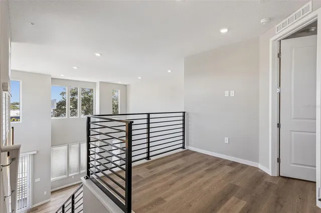a view of an entryway with wooden floor