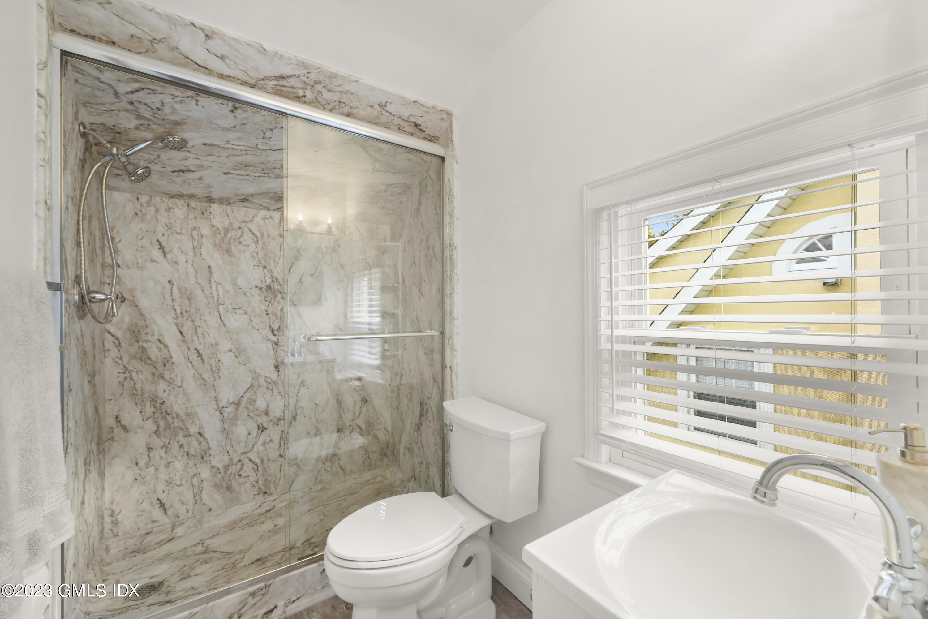 39 Bible Street, Unit 2 Cos Cob, CT 06807 - Photo 12 of 15 a bathroom with a sink toilet and shower