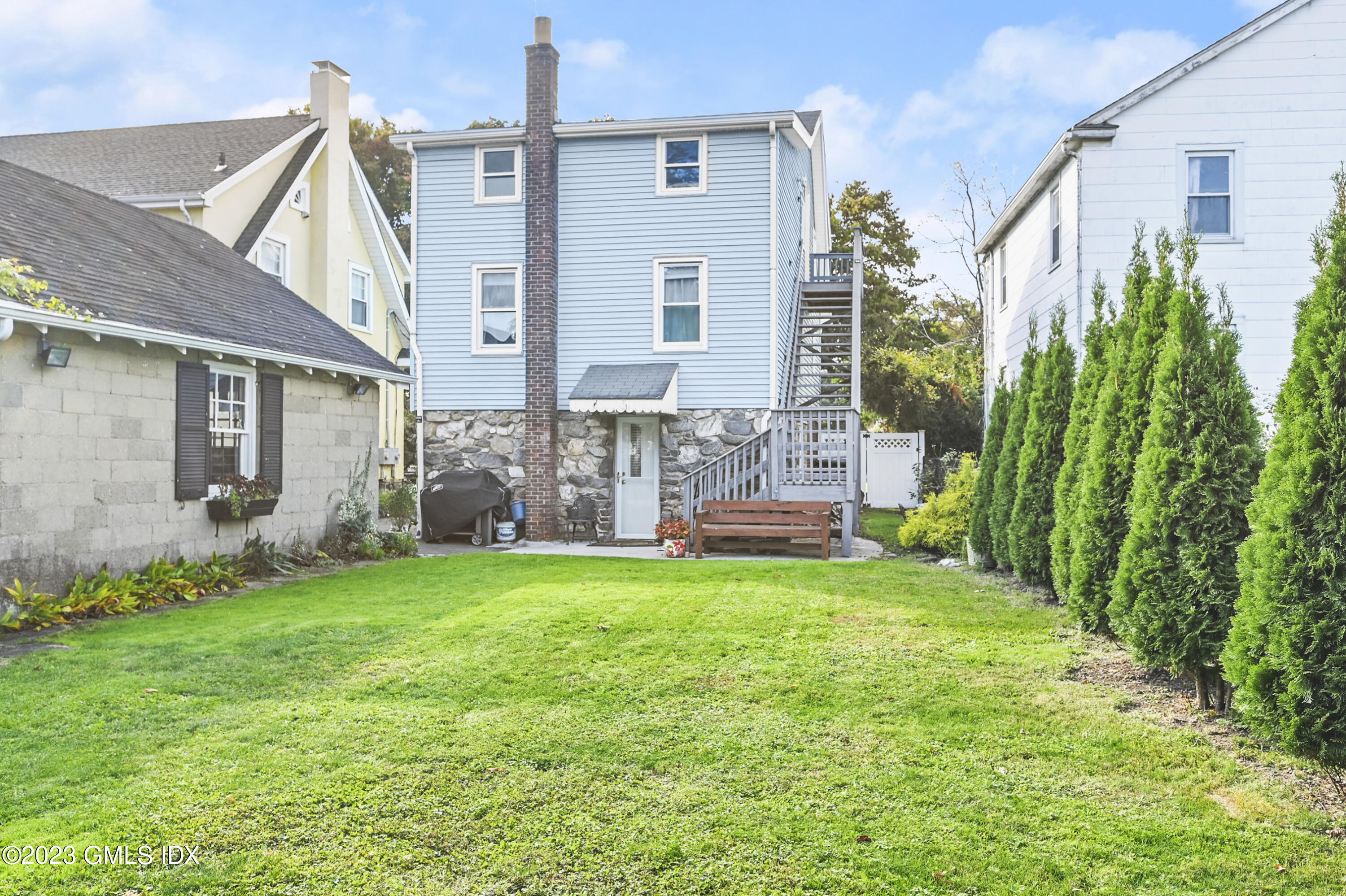 39 Bible Street, Unit 2 Cos Cob, CT 06807 - Photo 3 of 15 a view of a house with backyard and porch