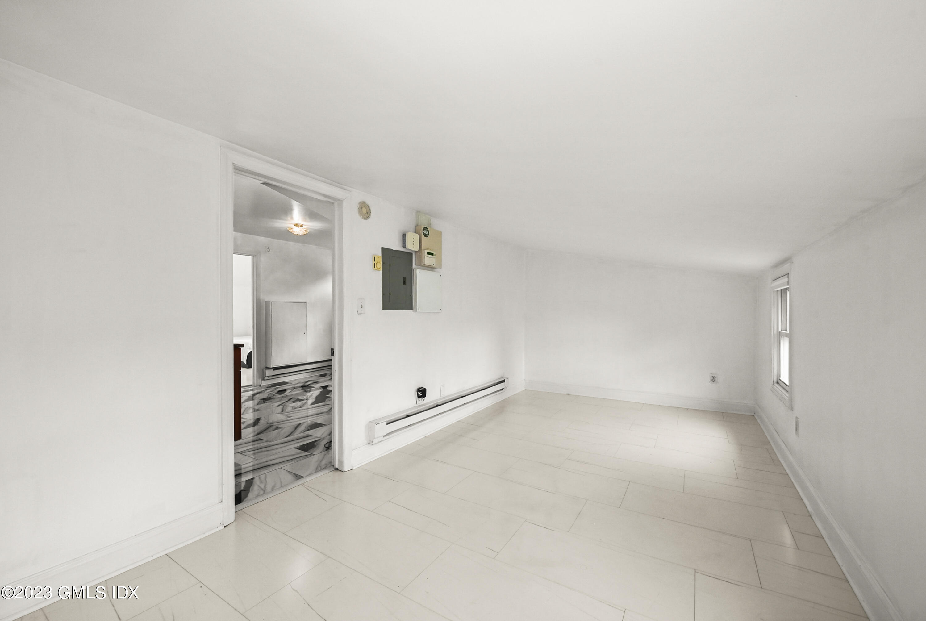 39 Bible Street, Unit 2 Cos Cob, CT 06807 - Photo 7 of 15 an empty room with cabinet and mirrors