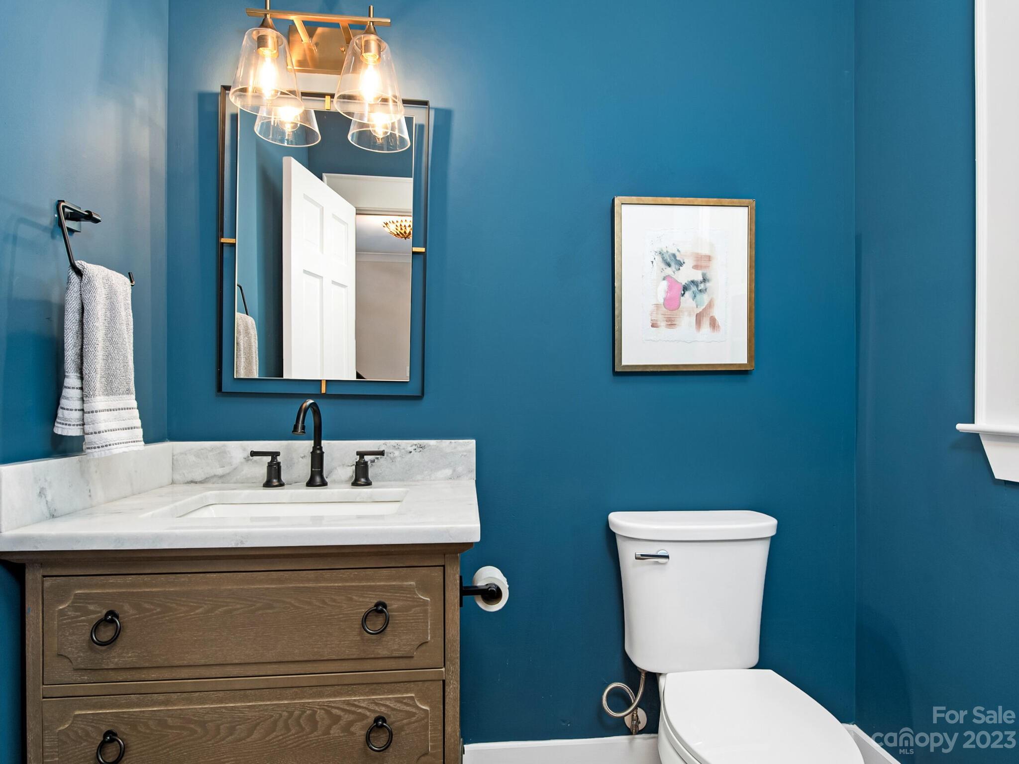 1815 Harris Road Charlotte, NC 28211 - Photo 16 of 32 a bathroom with a toilet sink and mirror