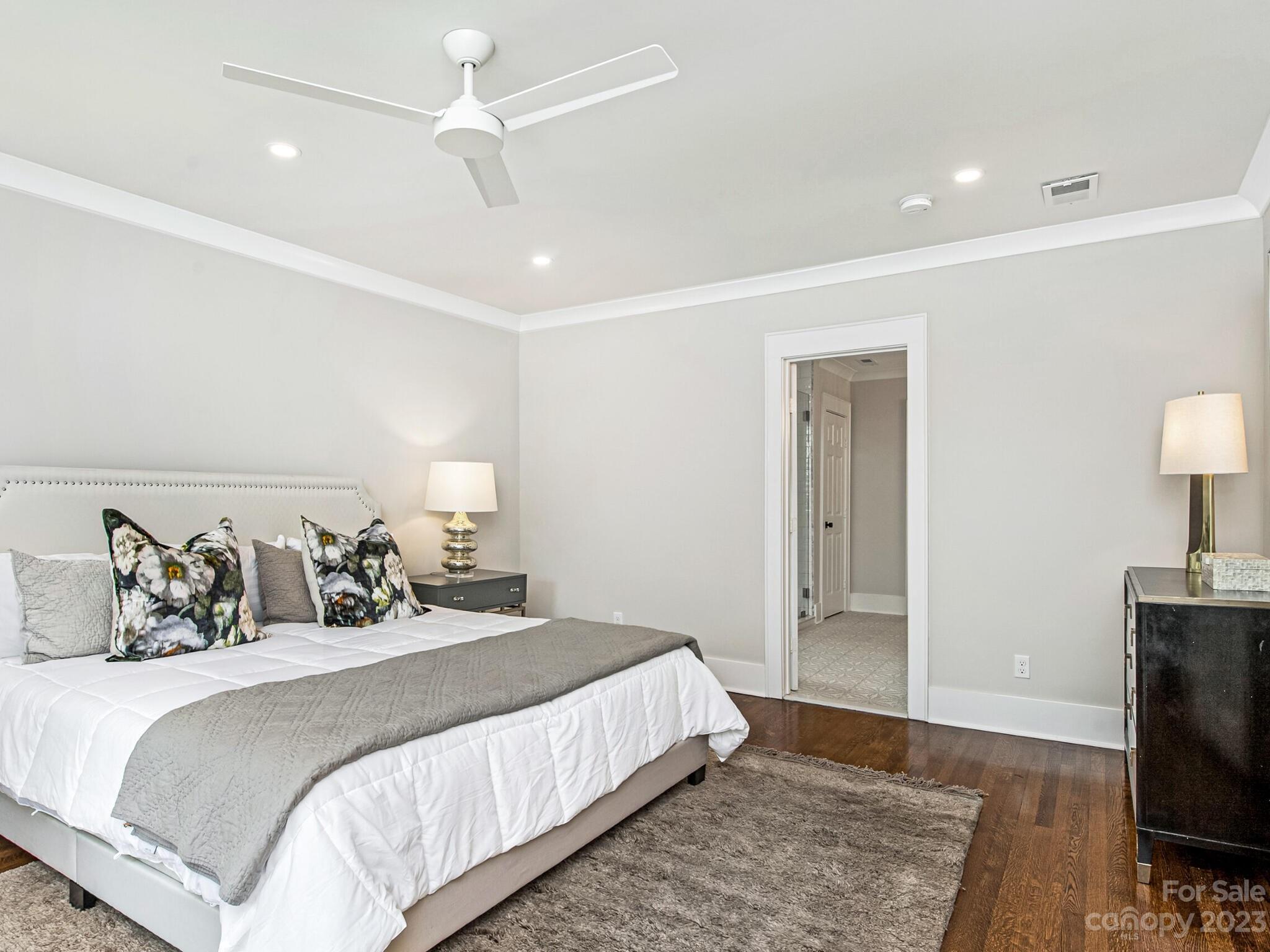 1815 Harris Road Charlotte, NC 28211 - Photo 19 of 32 a bedroom with a bed and a flat screen tv