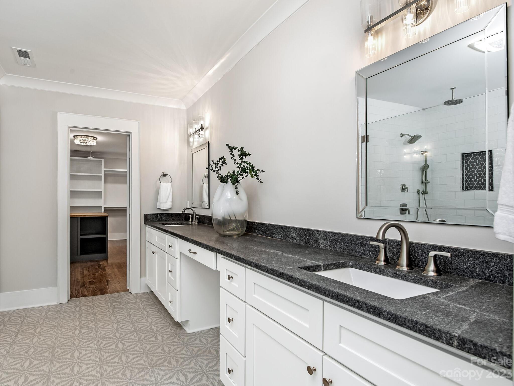 1815 Harris Road Charlotte, NC 28211 - Photo 20 of 32 a bathroom with a granite countertop sink and a mirror
