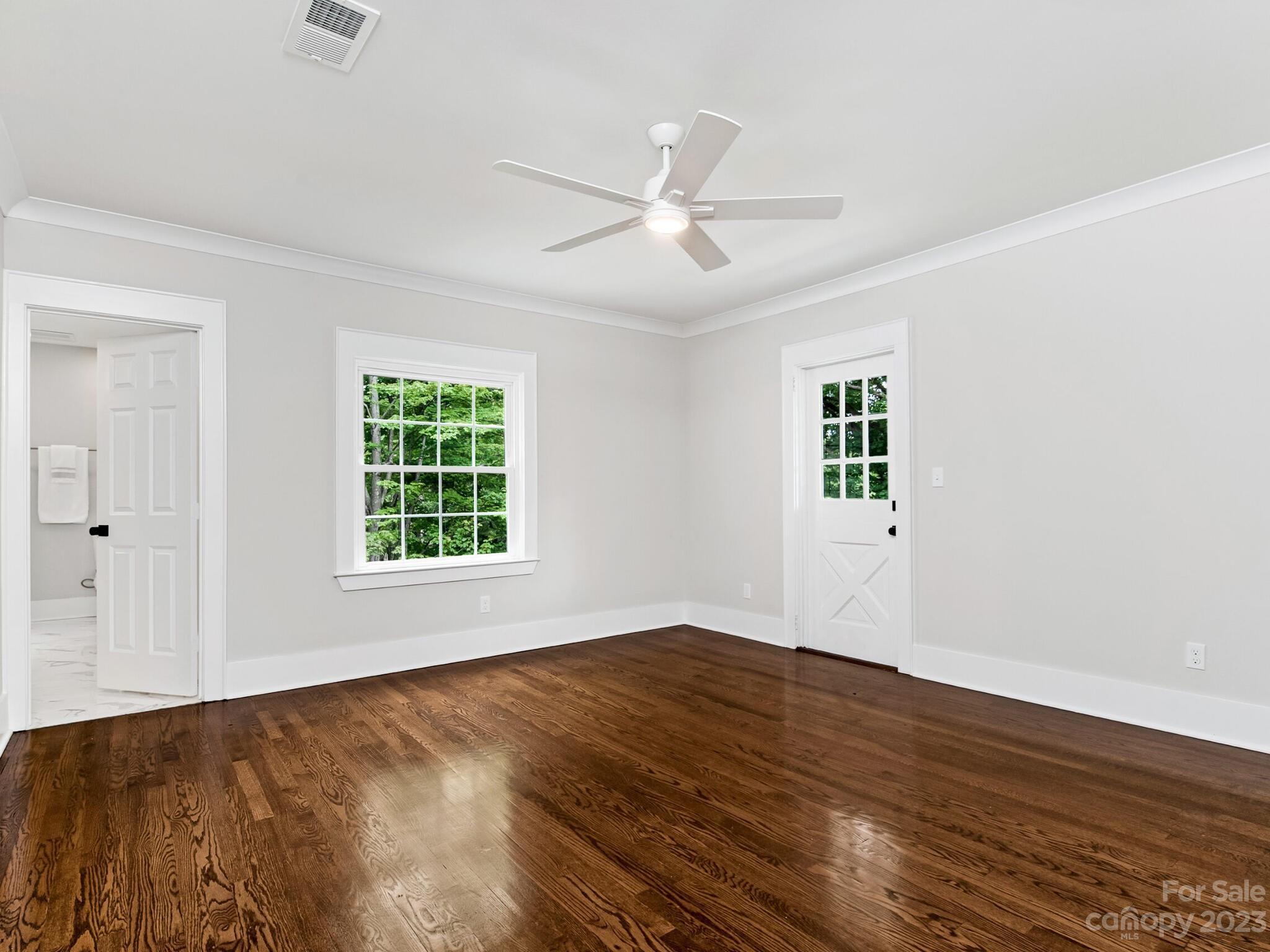 1815 Harris Road Charlotte, NC 28211 - Photo 23 of 32 a view of an empty room with wooden floor and a window
