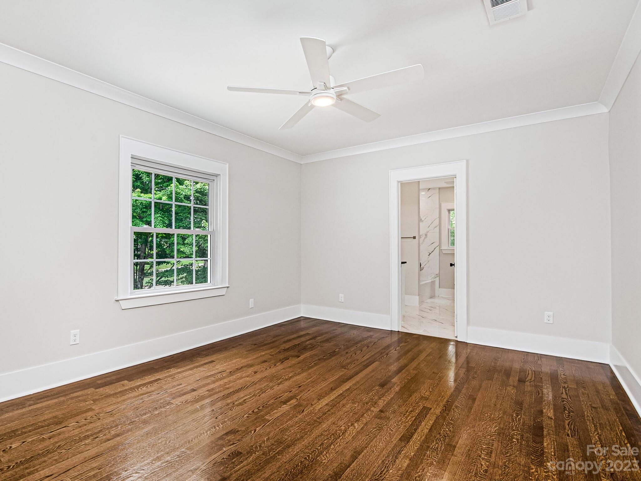 1815 Harris Road Charlotte, NC 28211 - Photo 25 of 32 wooden floor in an empty room with a window