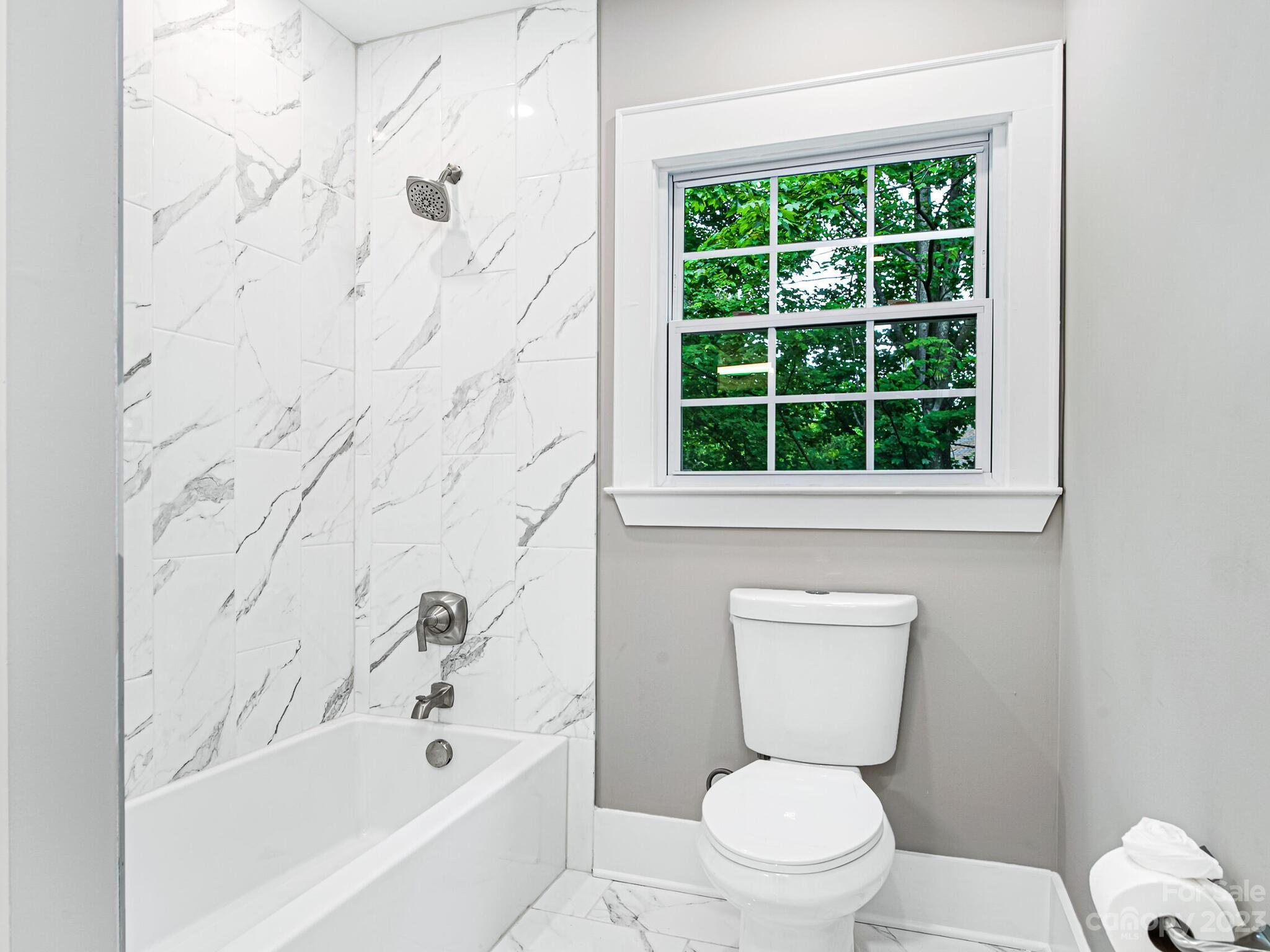 1815 Harris Road Charlotte, NC 28211 - Photo 26 of 32 a bathroom with a toilet a sink and a bathtub