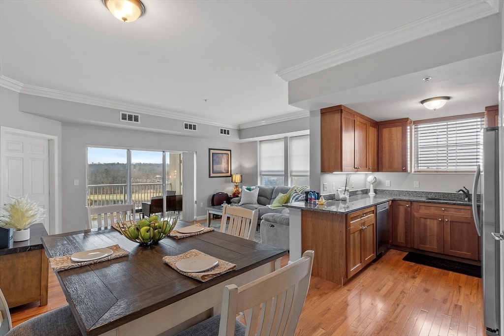 38 Village Road, Unit 602 Middleton, MA 01949 - Photo 6 of 42 a kitchen with granite countertop lots of counter top space