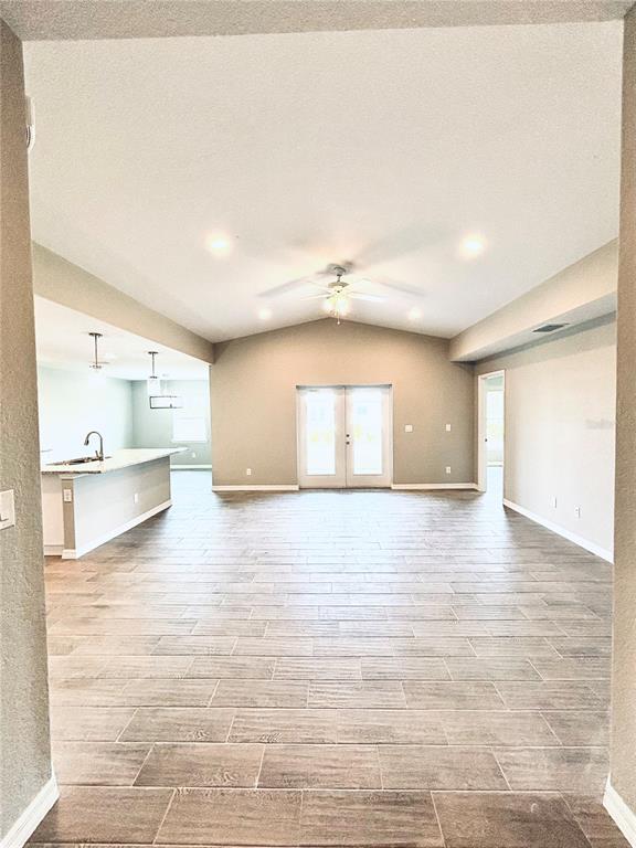415 Baytree Drive Rotonda West, FL 33947 - Photo 2 of 3 a view of empty room with wooden floor