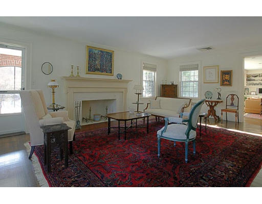 25 Manor House Road Newton, MA 02459 - Photo 3 of 7 a living room with furniture a fireplace and wooden floor