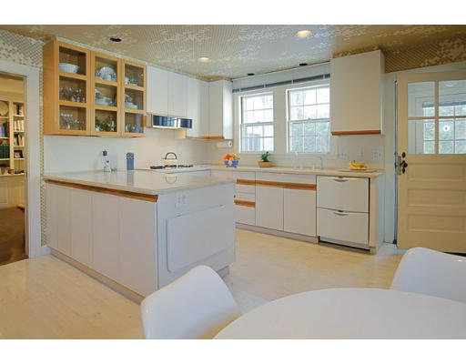 25 Manor House Road Newton, MA 02459 - Photo 4 of 7 a kitchen with a sink cabinets and window