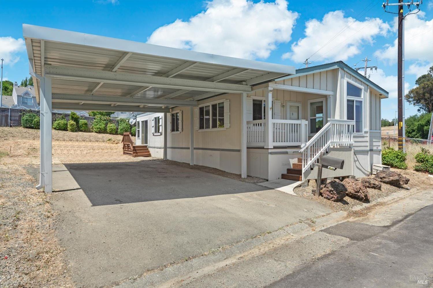 a view of a patio with table and chairs