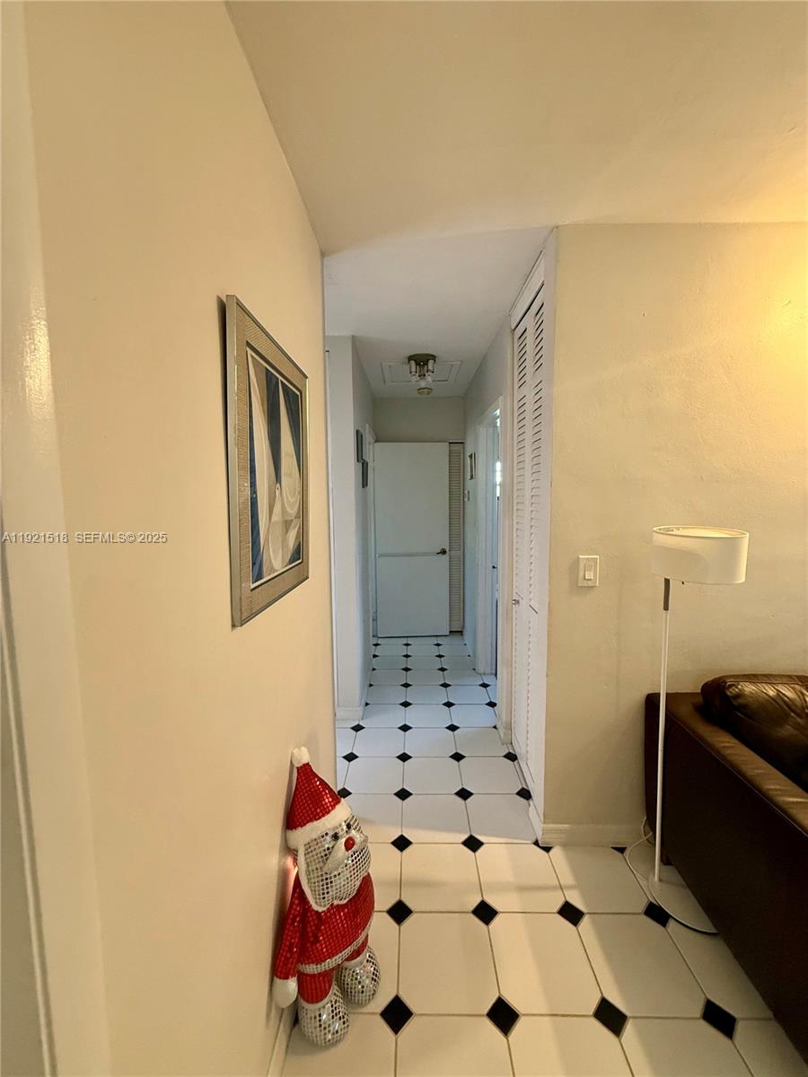 8070 Northwest 176th Street Hialeah, FL 33015 - Photo 11 of 26 a bathroom with a sink and a shower