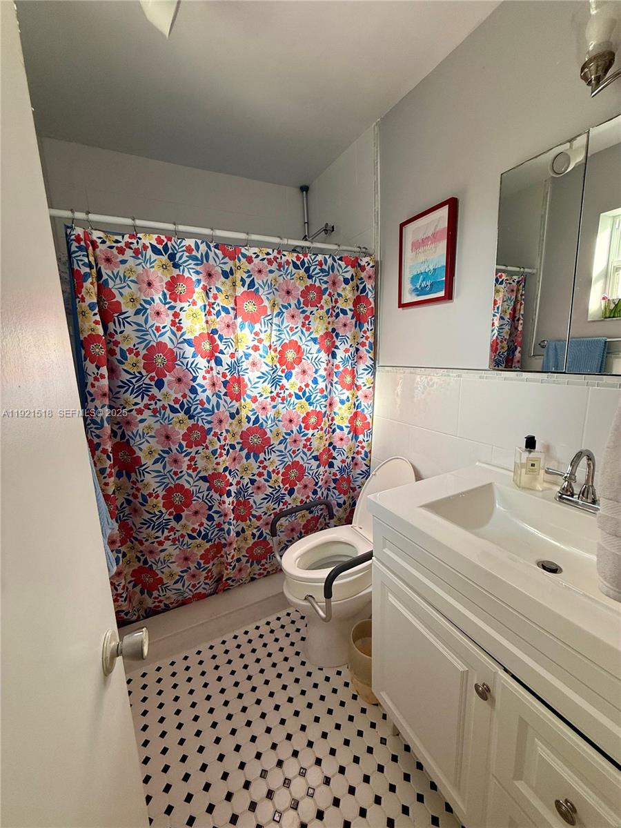 8070 Northwest 176th Street Hialeah, FL 33015 - Photo 13 of 26 a bathroom with a sink toilet and shower