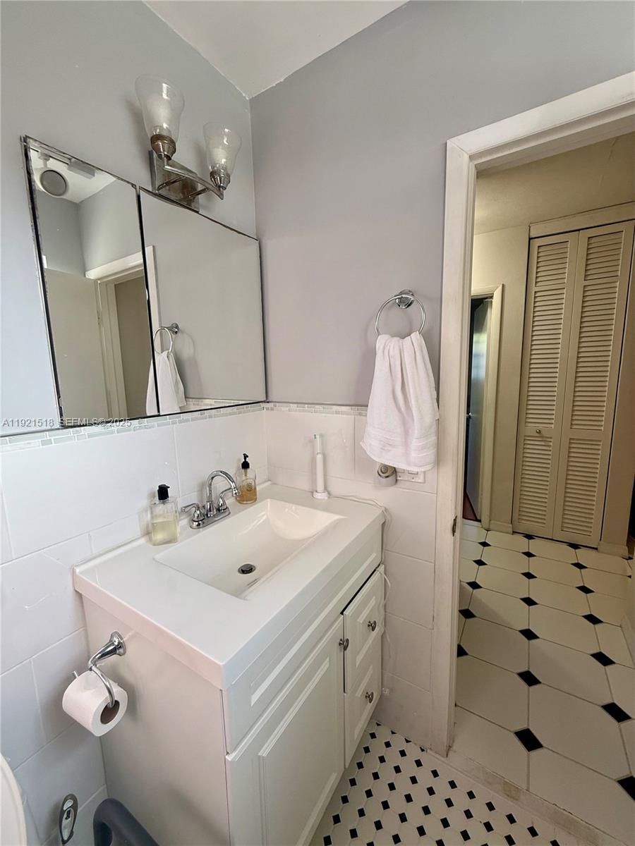 8070 Northwest 176th Street Hialeah, FL 33015 - Photo 14 of 26 a bathroom with a sink and a mirror