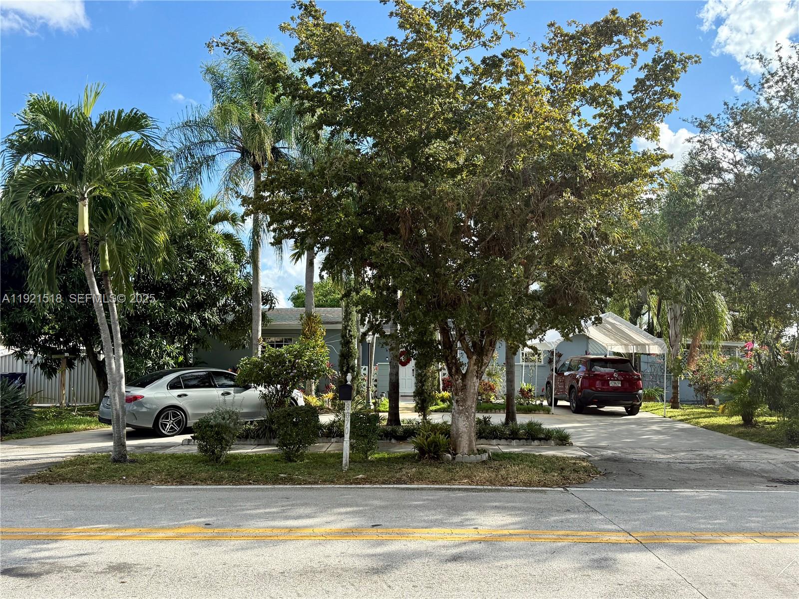 8070 Northwest 176th Street Hialeah, FL 33015 - Photo 3 of 26 a car parked on the side of a street