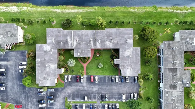 an aerial view of a house with a swimming pool