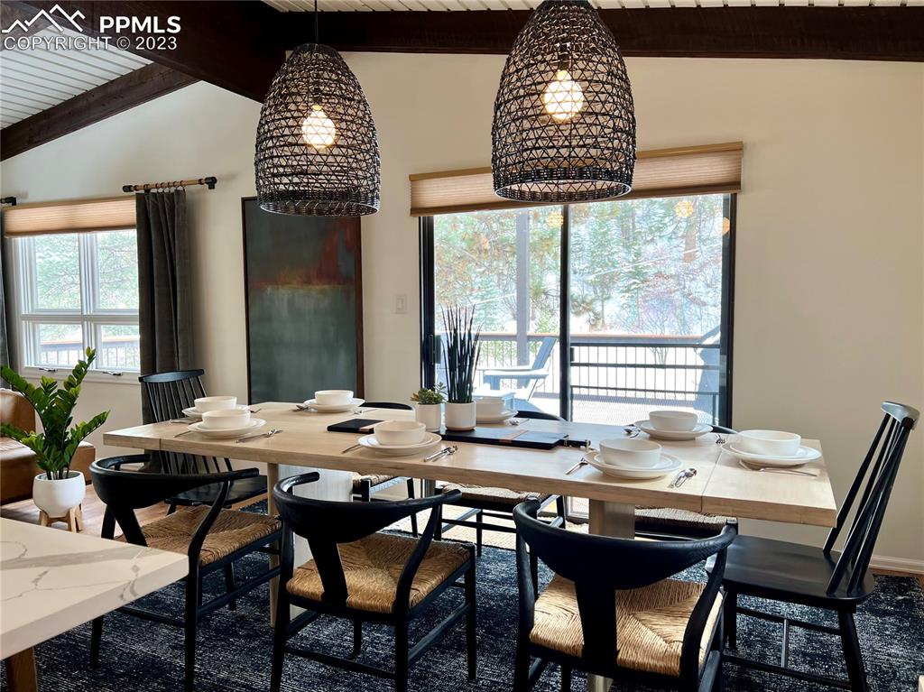 9660 Mohawk Trail Cascade, CO 80809 - Photo 13 of 43 a view of a dining room with furniture window and outside view