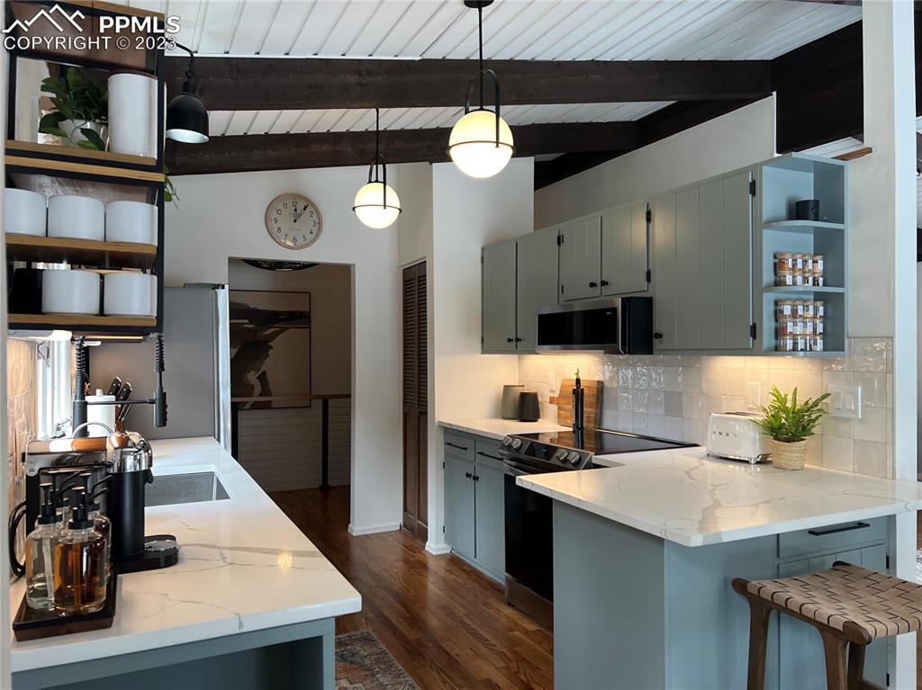 9660 Mohawk Trail Cascade, CO 80809 - Photo 15 of 43 a kitchen with a counter space cabinets and stainless steel appliances