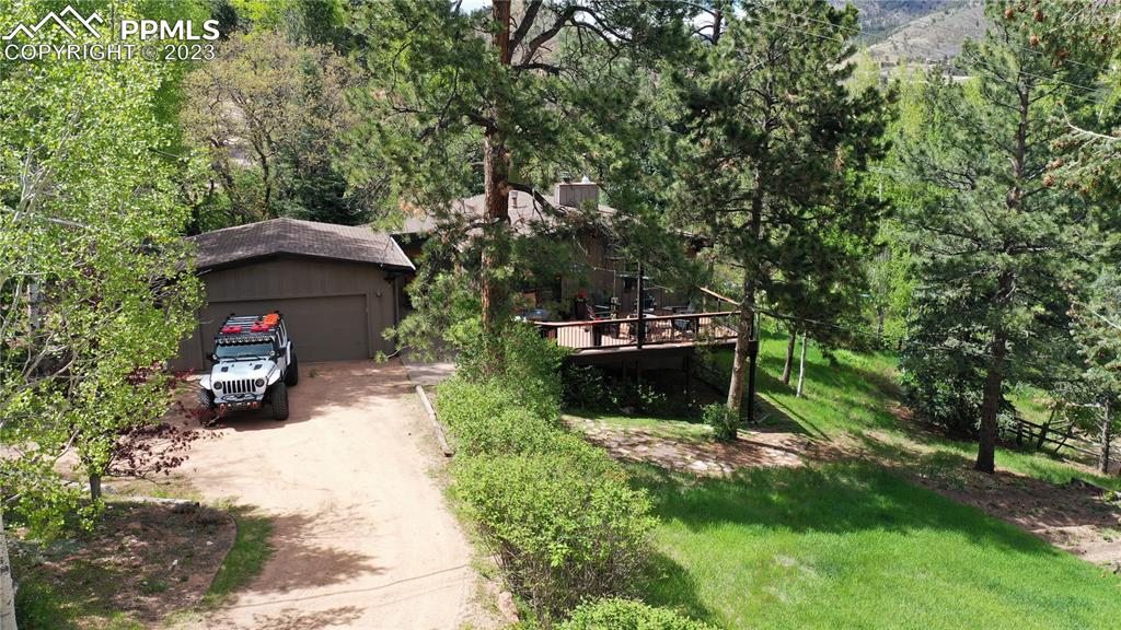 9660 Mohawk Trail Cascade, CO 80809 - Photo 34 of 43 a view of a couches under an umbrella