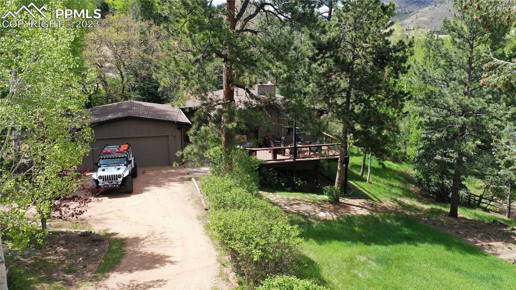 9660 Mohawk Trail Cascade, CO 80809 - Photo 38 of 43 a view of a couches under an umbrella