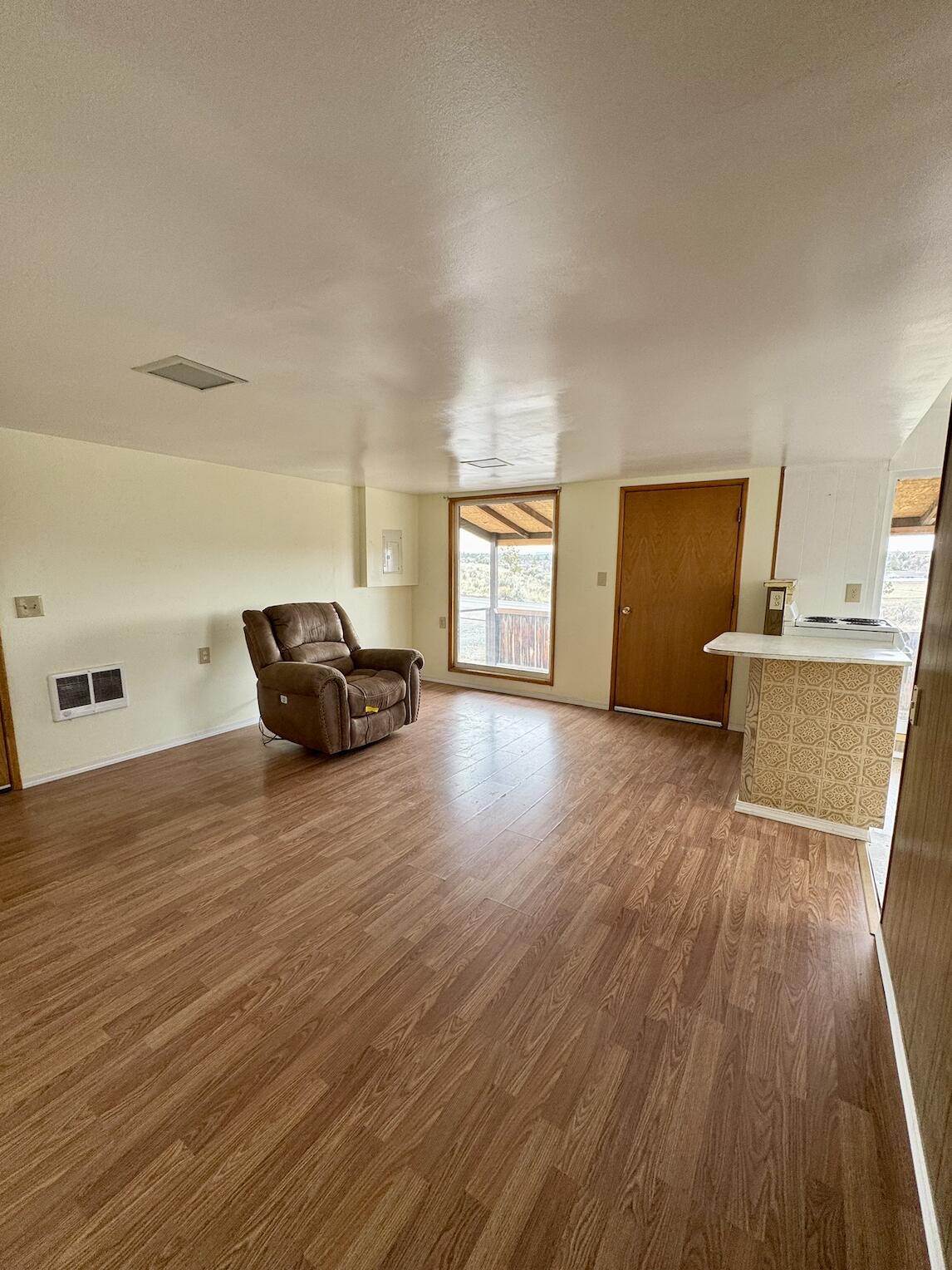 729 Southeast Grizzly Road Madras, OR 97741 - Photo 4 of 14 a living room with furniture and a wooden floor