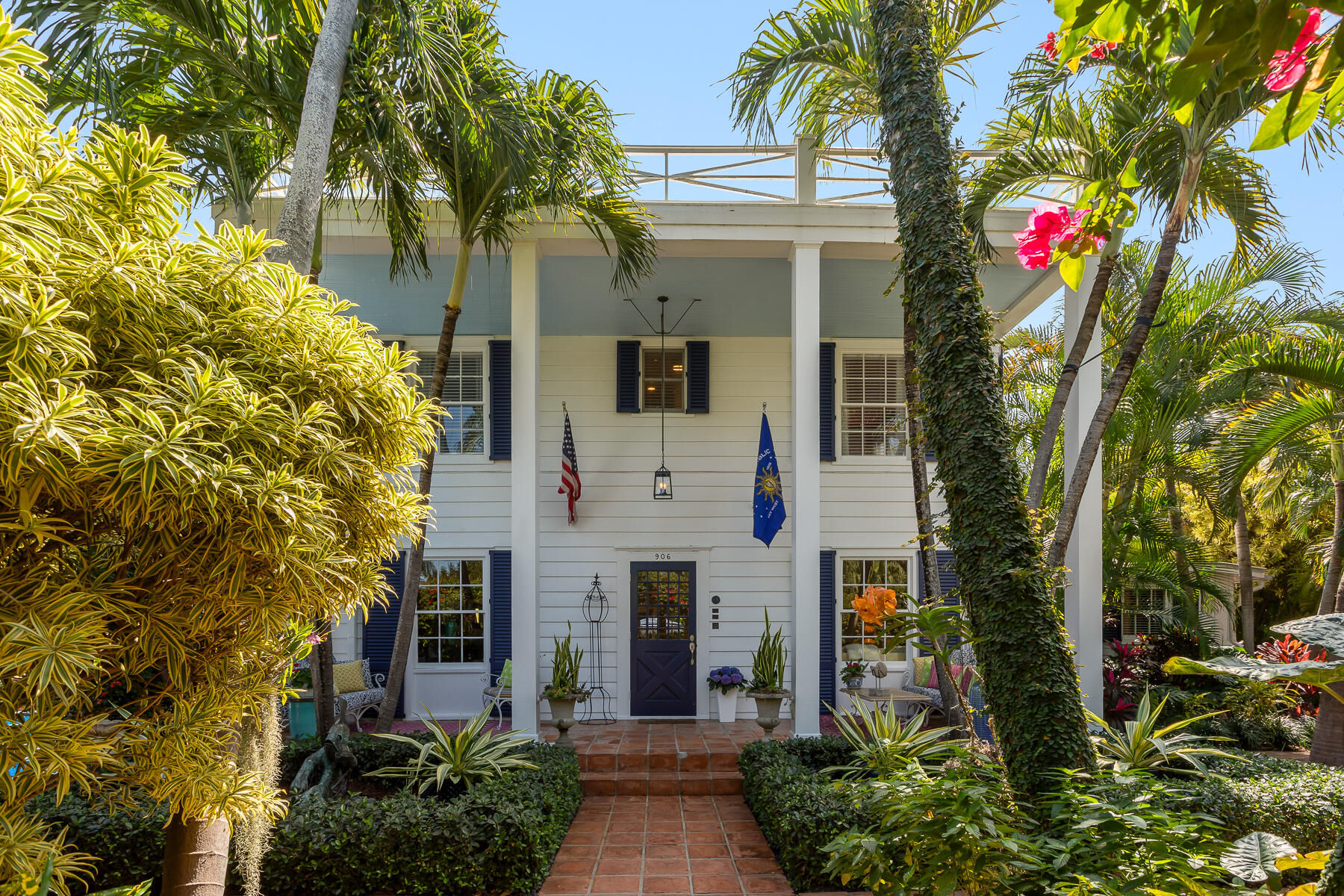 906 Johnson Street Key West, FL 33040 - Photo 4 of 65 a front view of a house with plants
