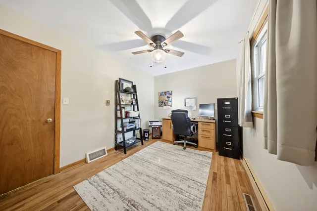 a bed room with a bed and a chandelier