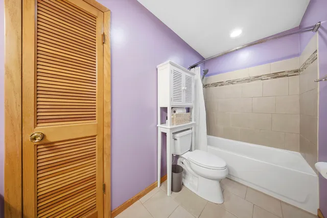 a bathroom with a toilet a sink and shower