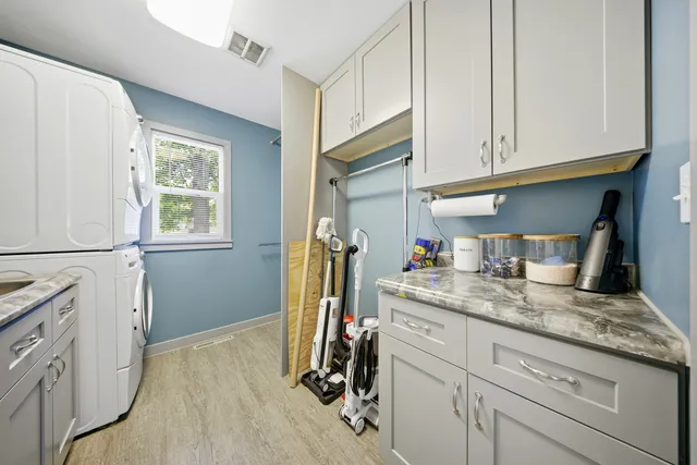 a kitchen with sink cabinets and wooden floor