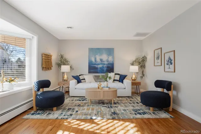 a living room with furniture rug and window