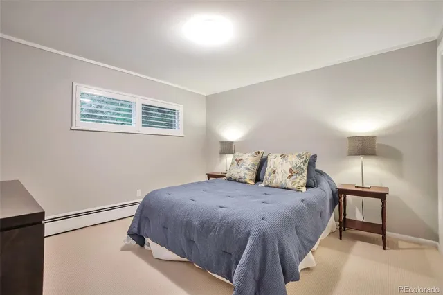 a bedroom with a bed and a night stand